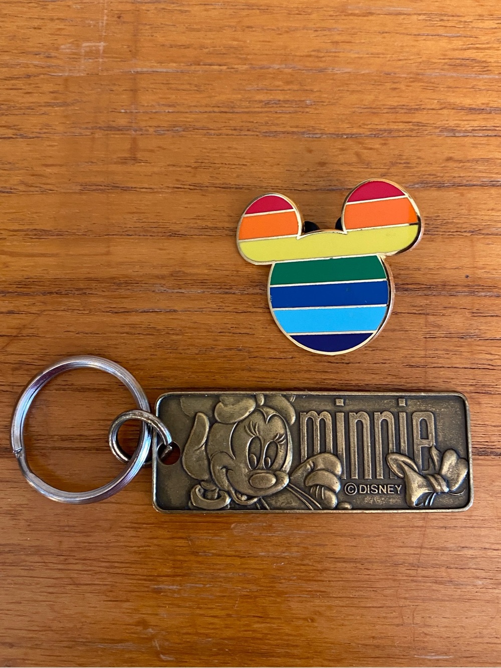 DISNEY Gold tone Rainbow Mickey Mouse logo pin w/ black Mickey pin holder. 2008